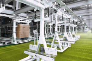 symbolic image intralogistics white twinshuttle ground handling equipment electrified floor track systemon green background
